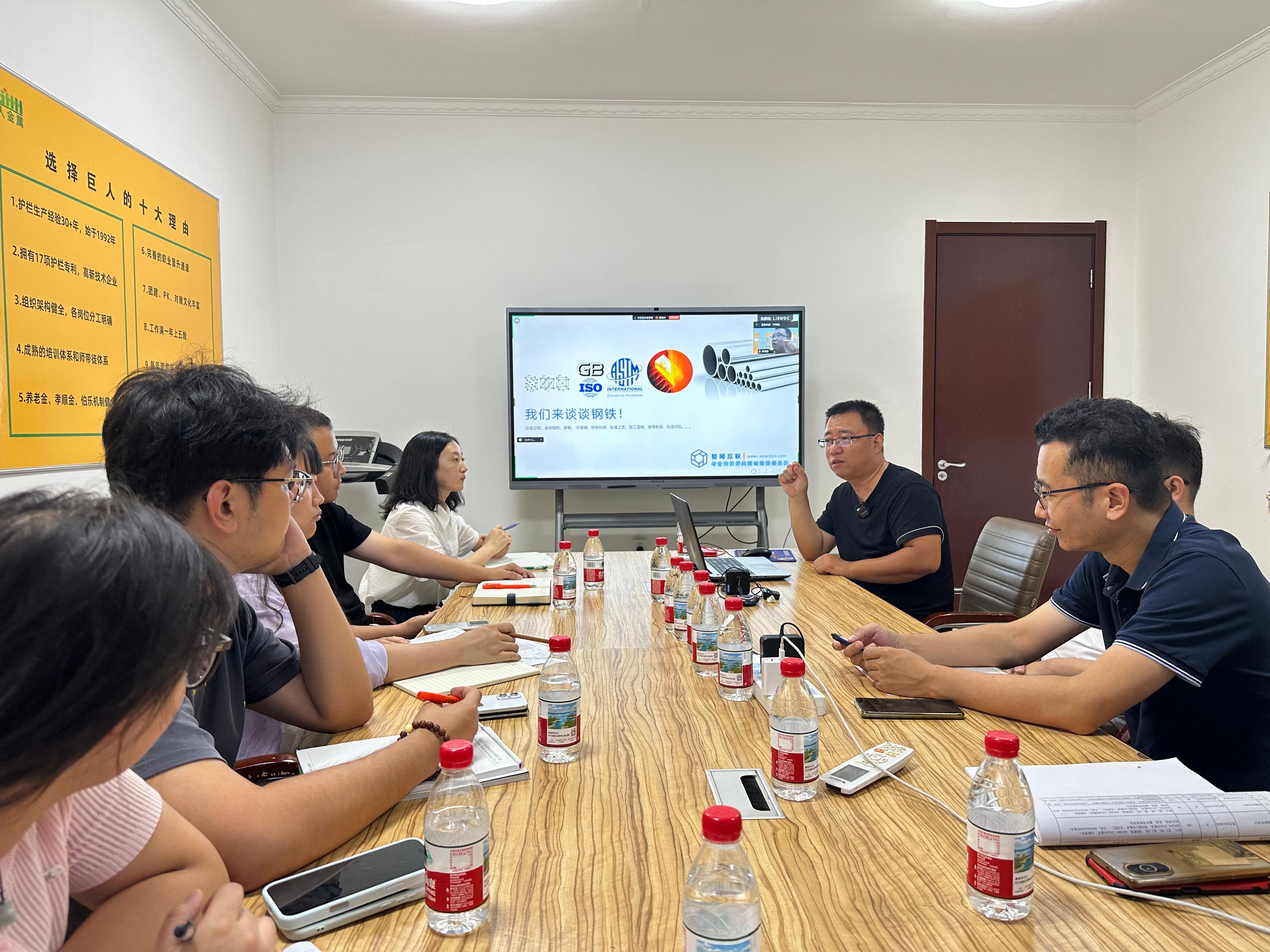 Person standing in a factory with machinery in the background