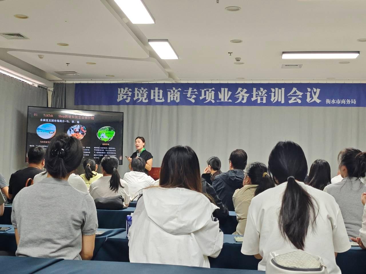 Person standing in a factory with machinery in the background