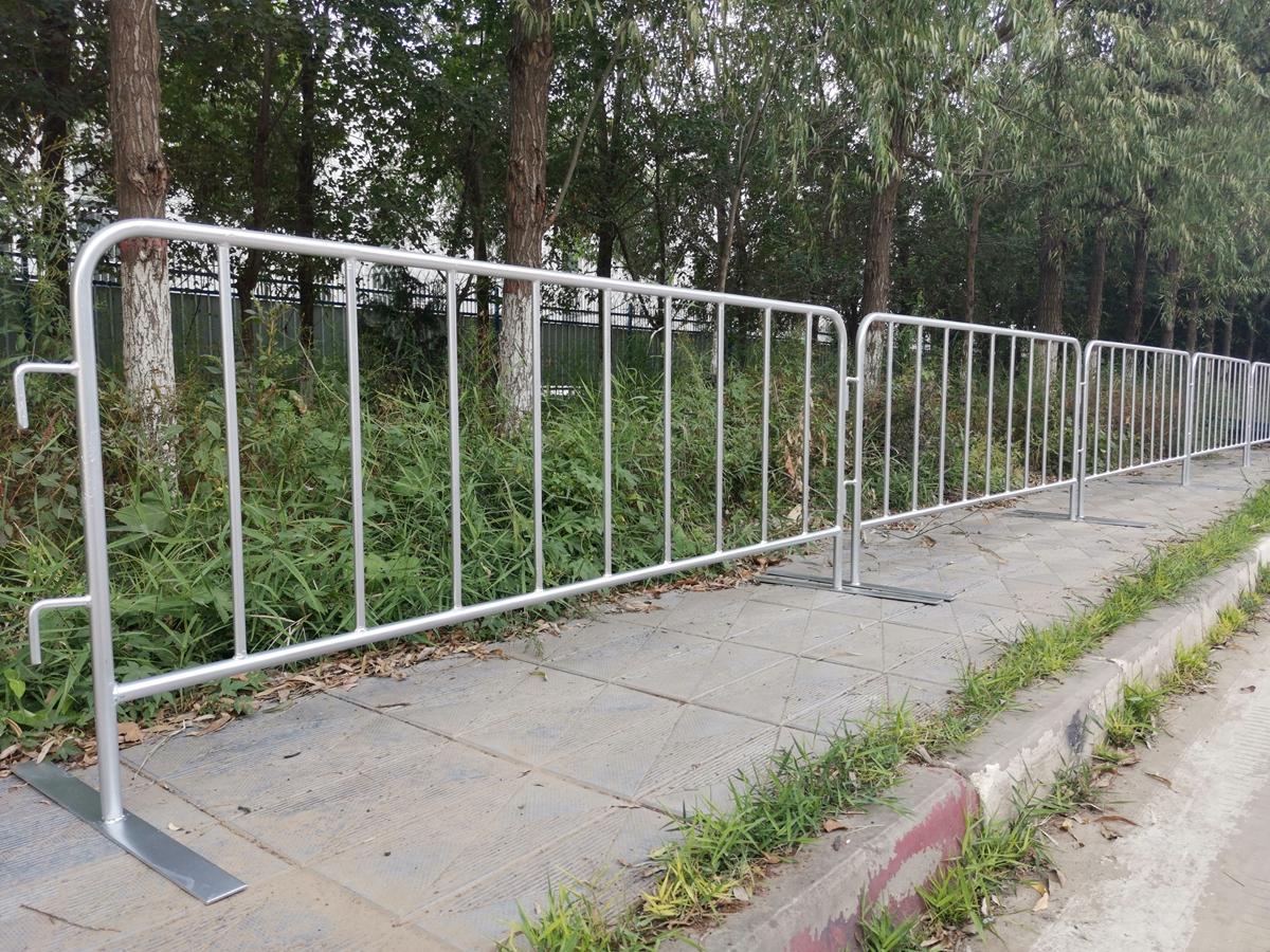 Person standing in a factory with machinery in the background