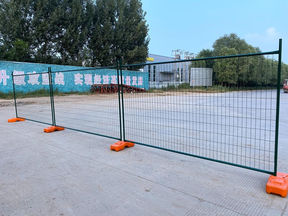 Person standing in a factory with machinery in the background