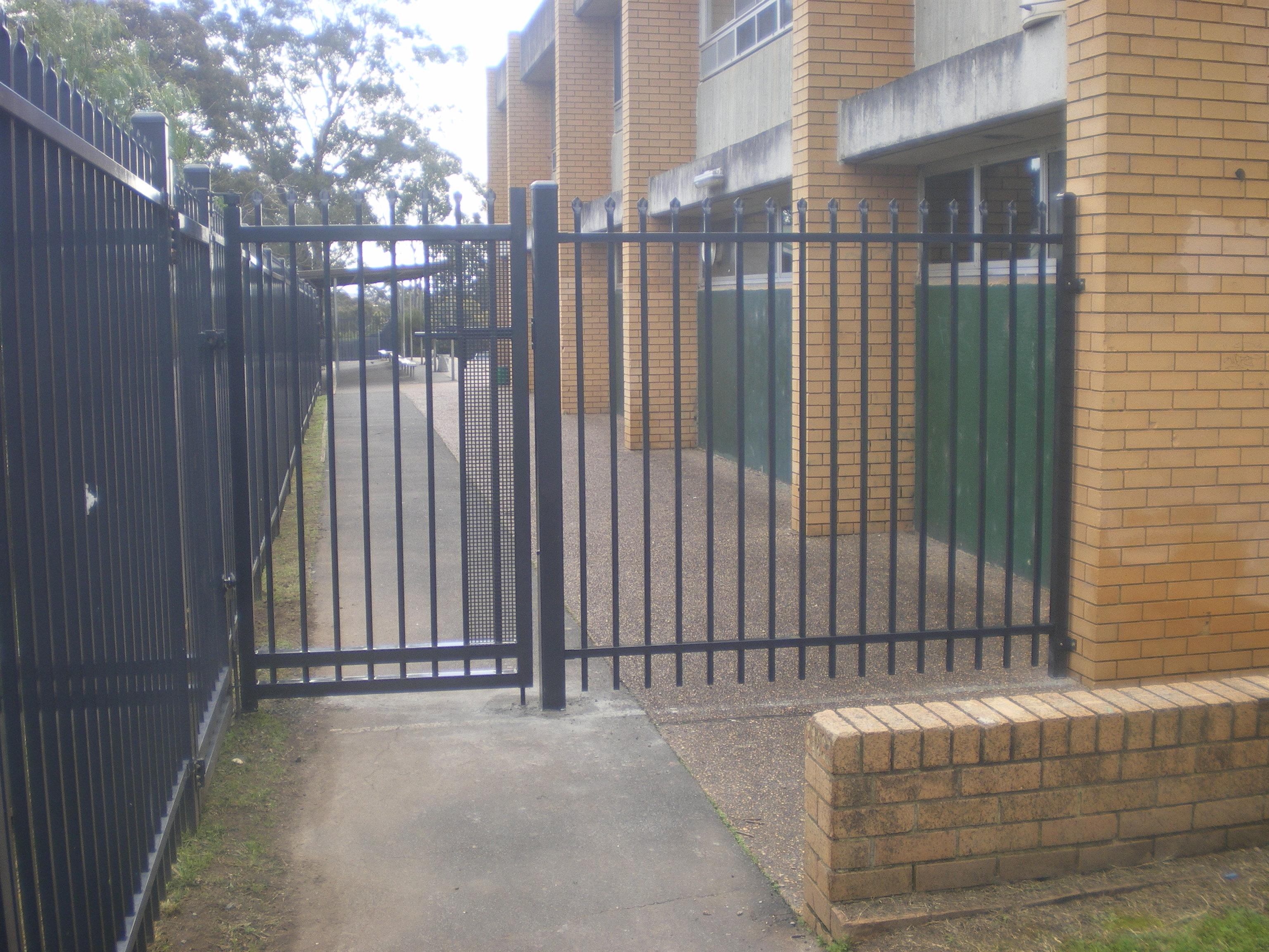 Person standing in a factory with machinery in the background