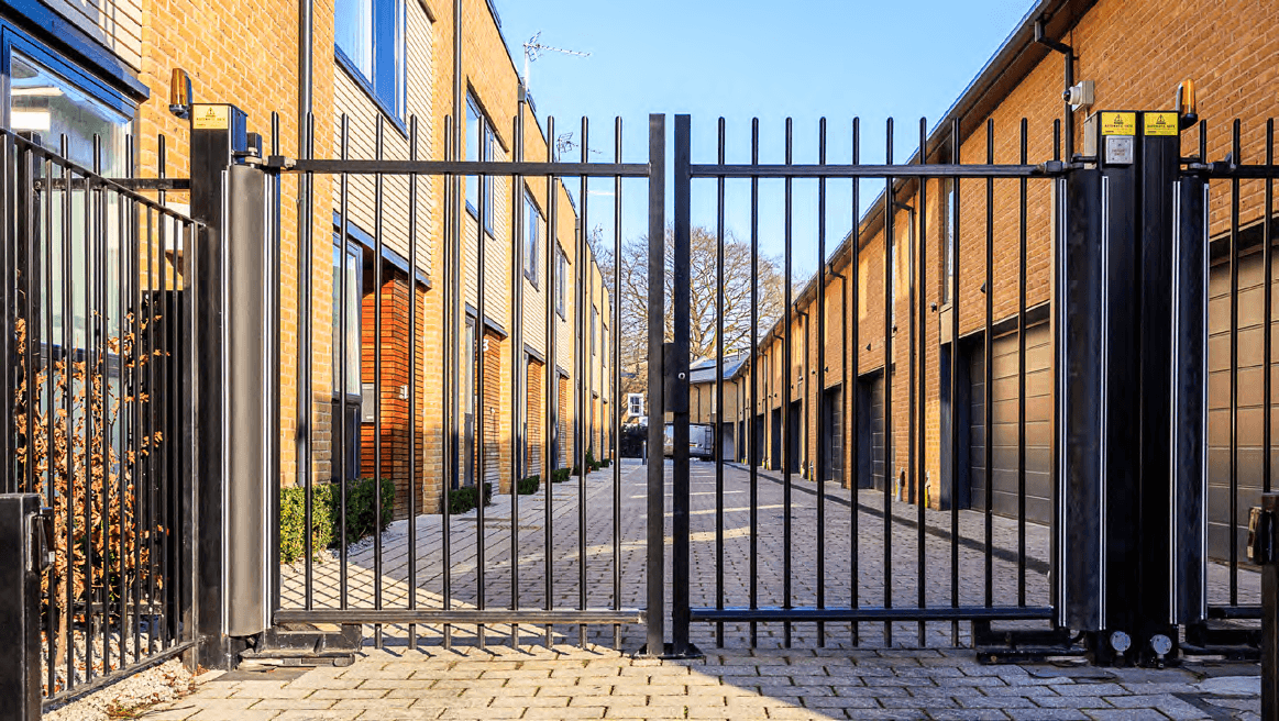 Person standing in a factory with machinery in the background
