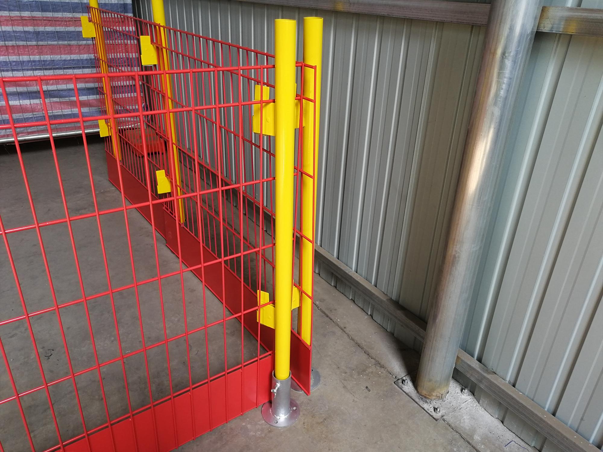 Person standing in a factory with machinery in the background