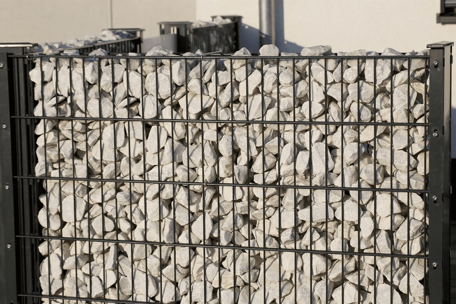 Person standing in a factory with machinery in the background