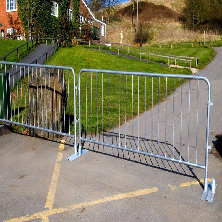 Person standing in a factory with machinery in the background