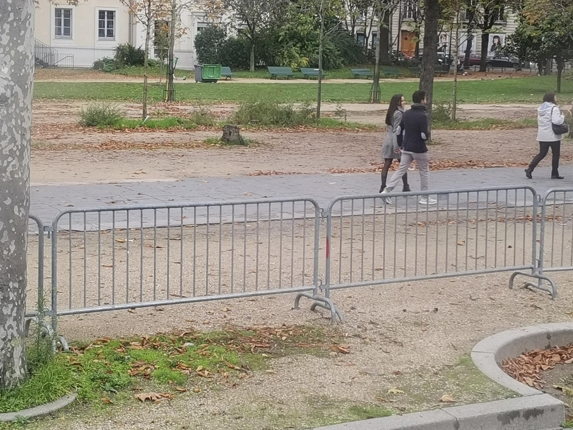 Person standing in a factory with machinery in the background