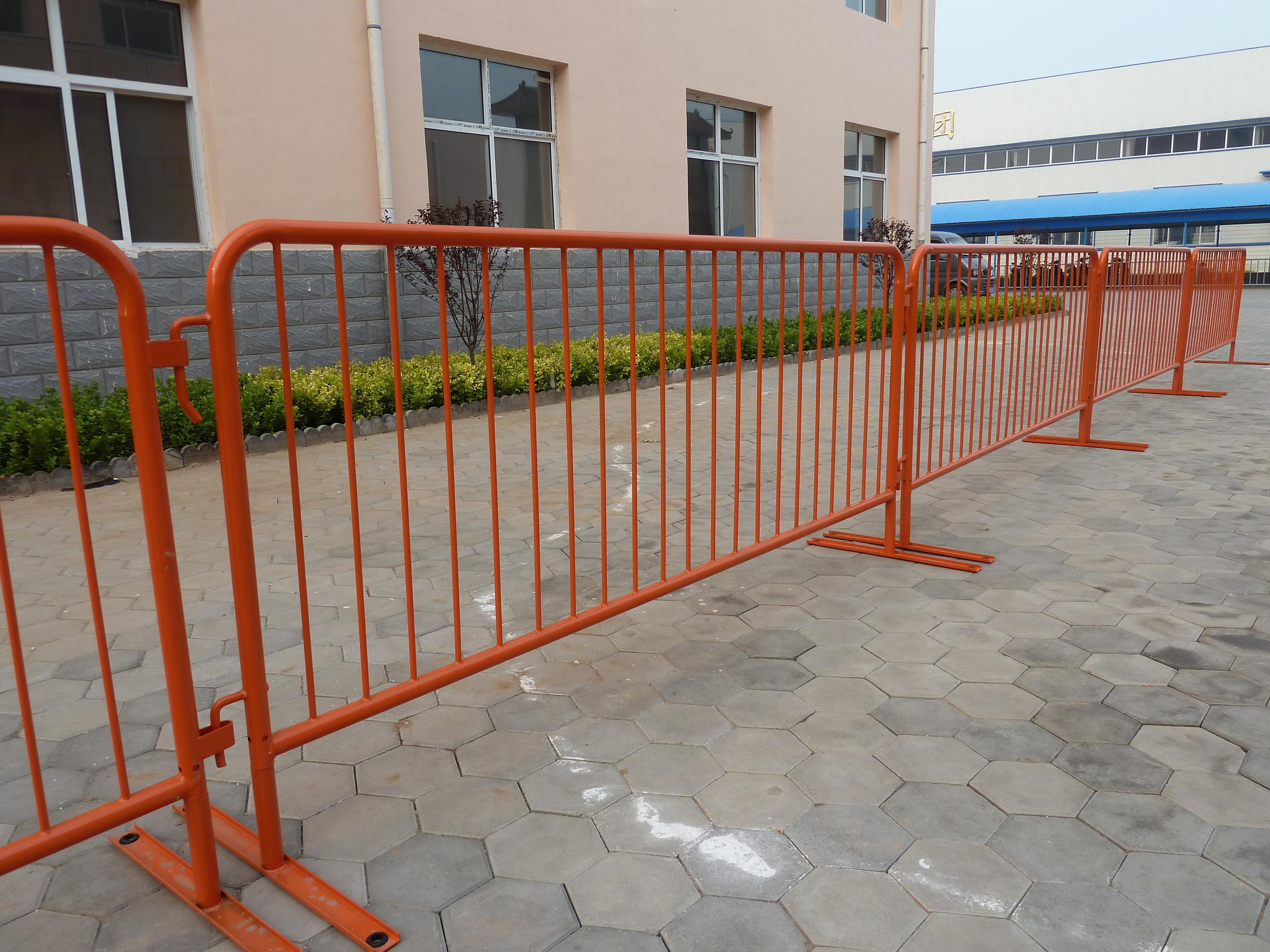 Person standing in a factory with machinery in the background