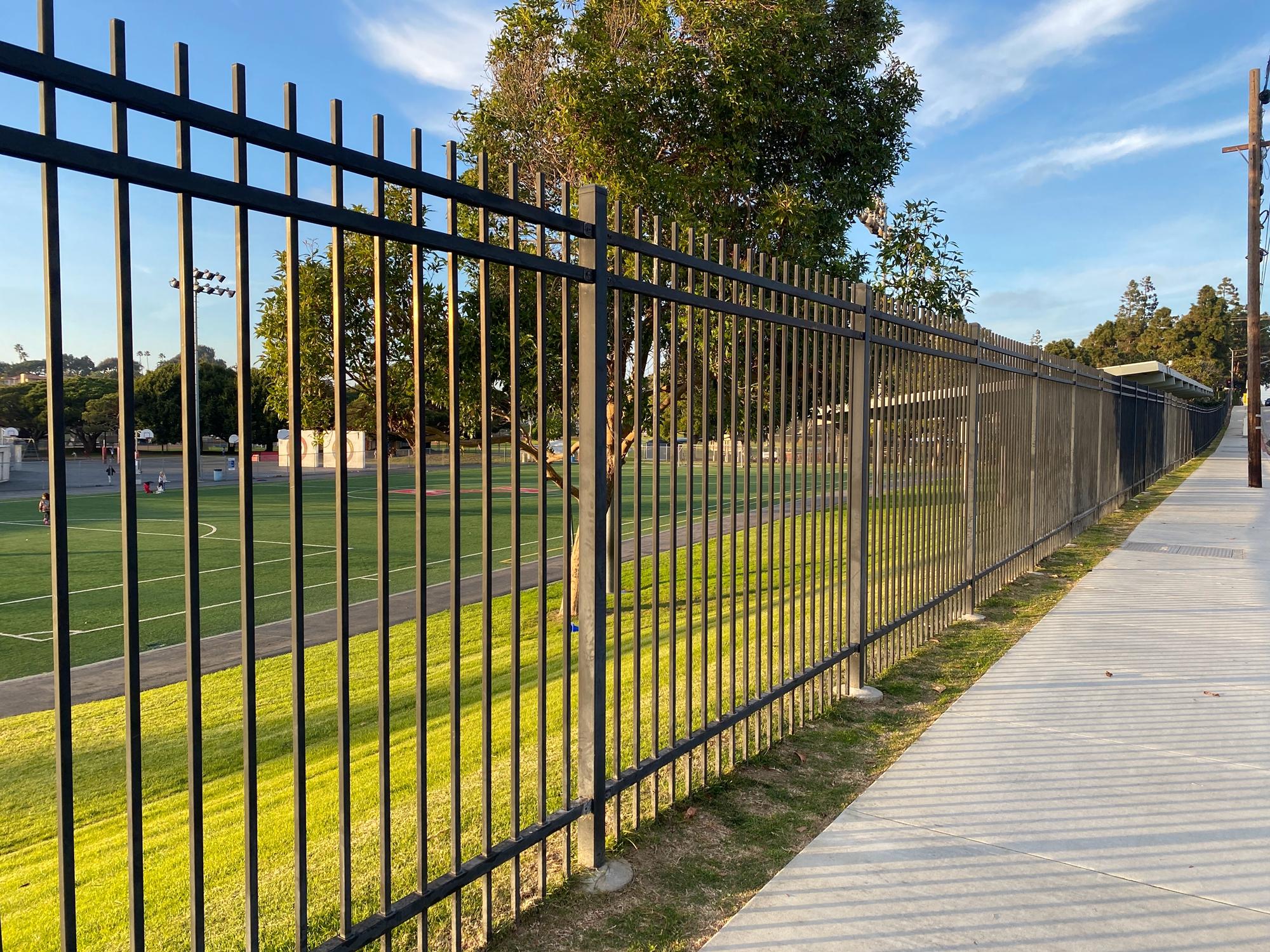 Person standing in a factory with machinery in the background