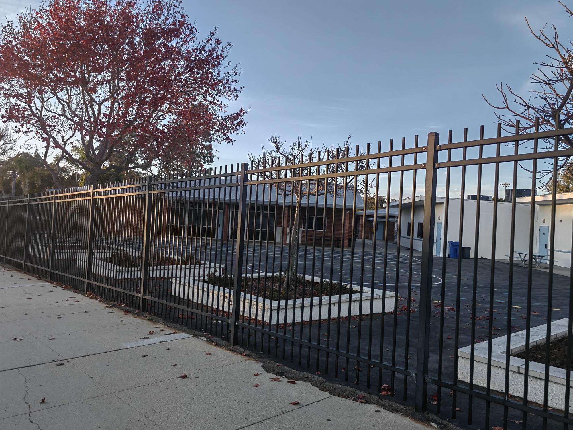 Person standing in a factory with machinery in the background