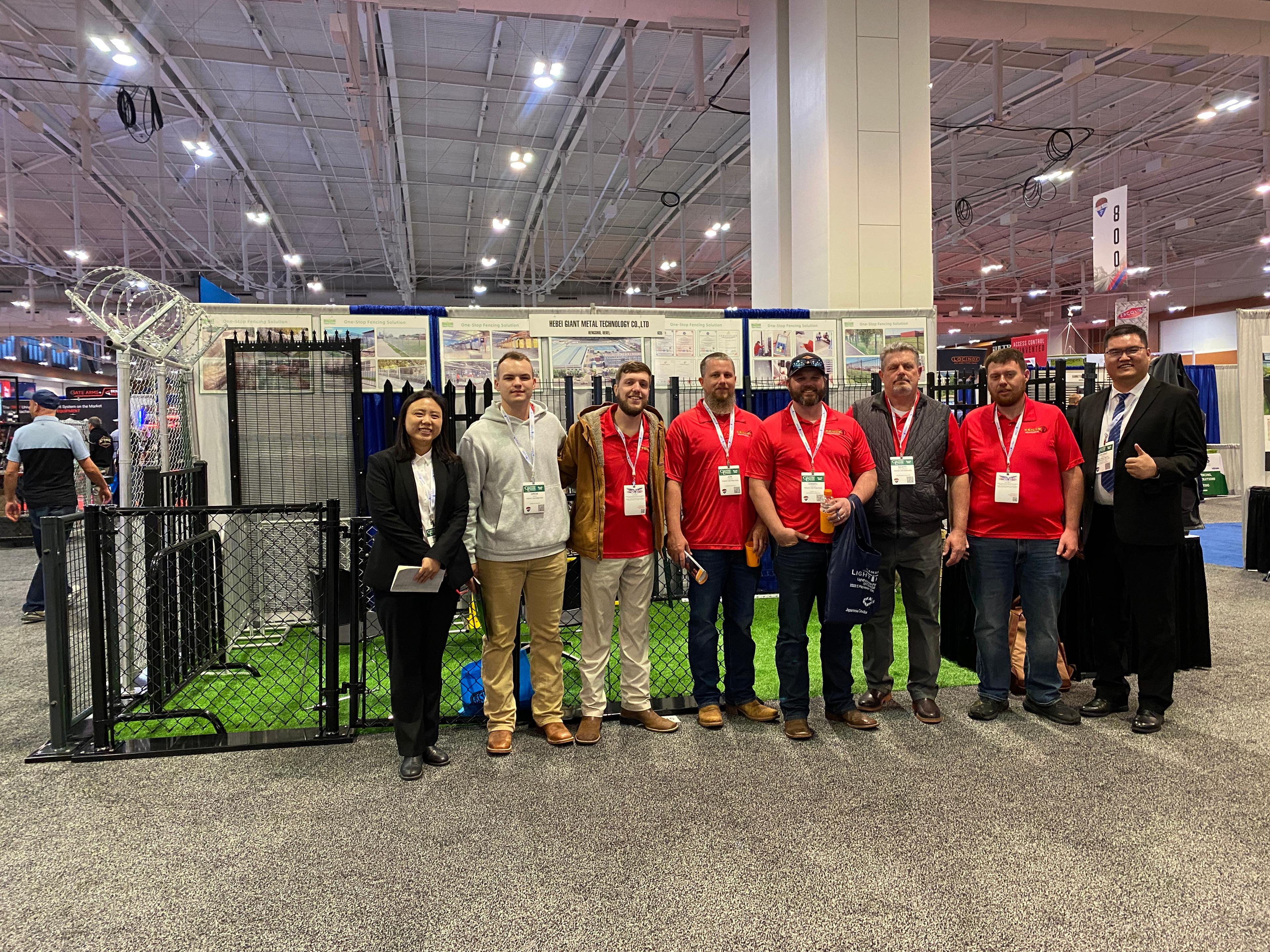 Person standing in a factory with machinery in the background