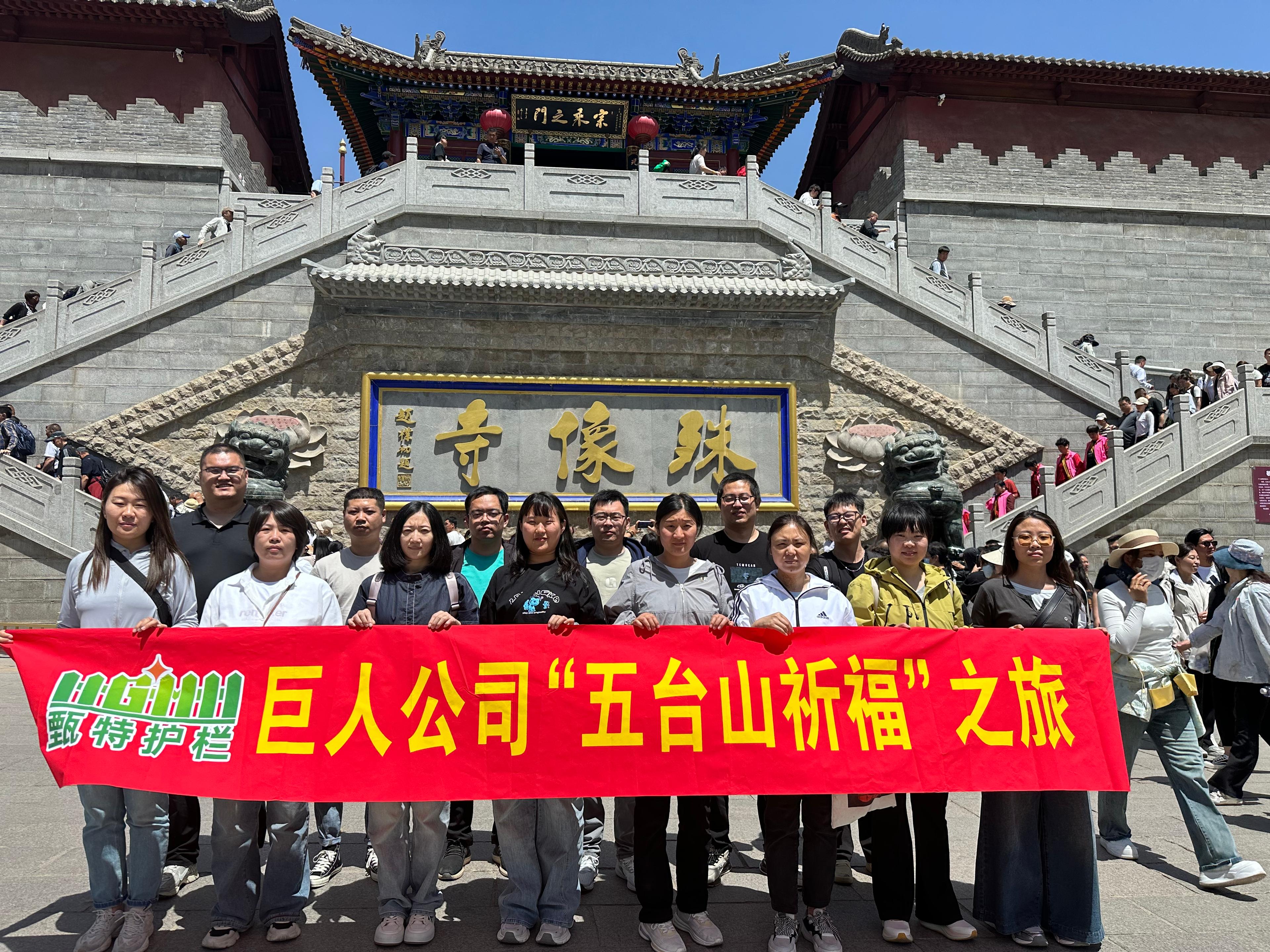 Person standing in a factory with machinery in the background
