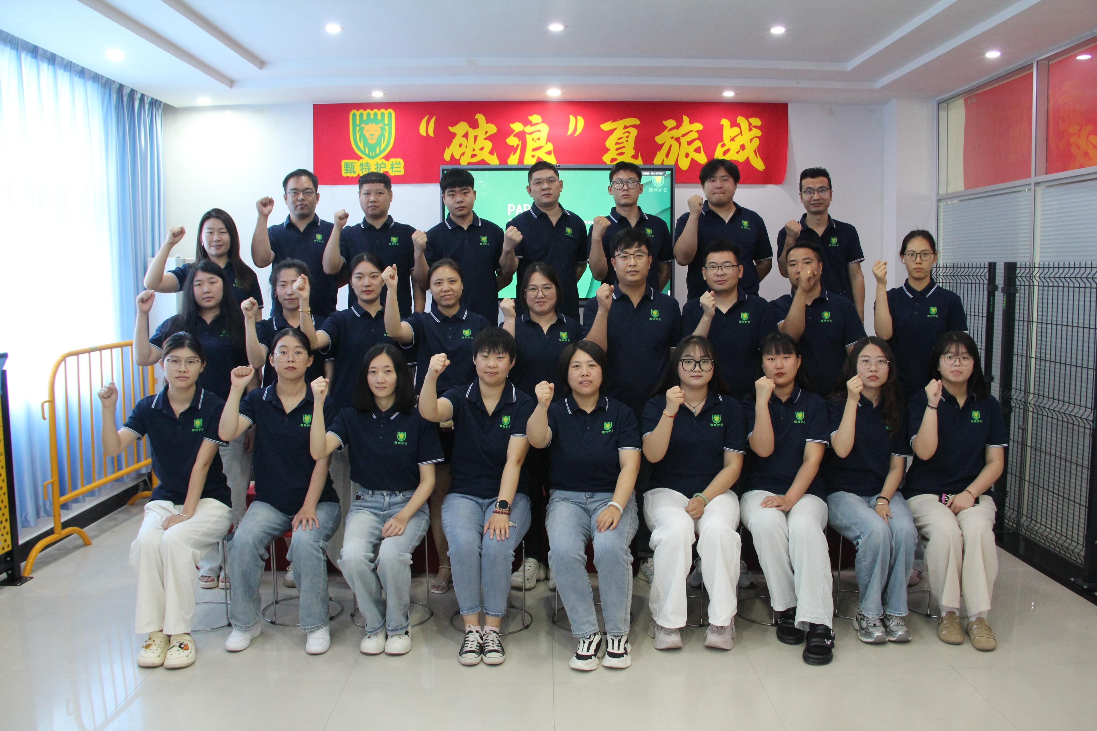 Person standing in a factory with machinery in the background