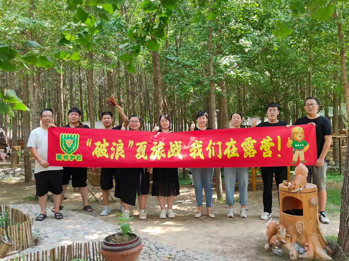 Person standing in a factory with machinery in the background