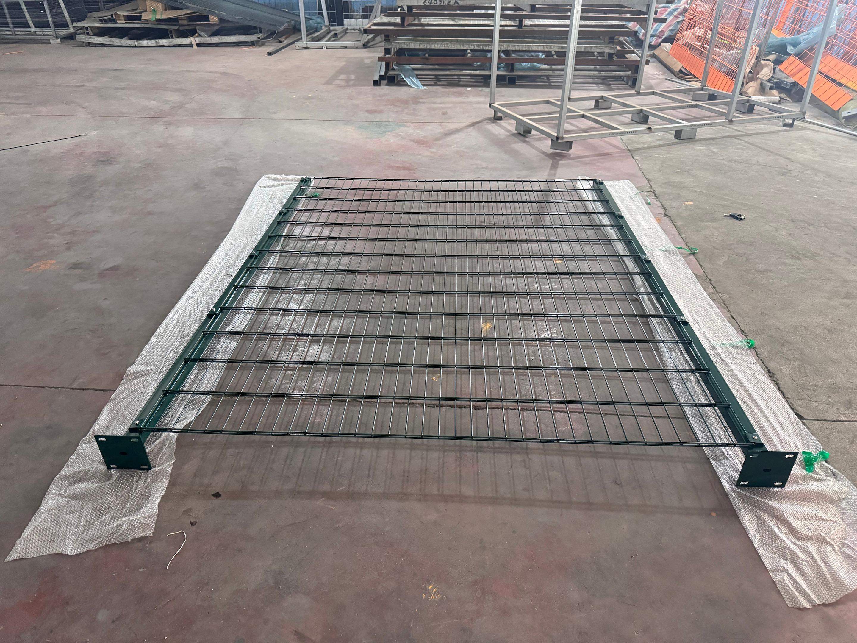 Person standing in a factory with machinery in the background