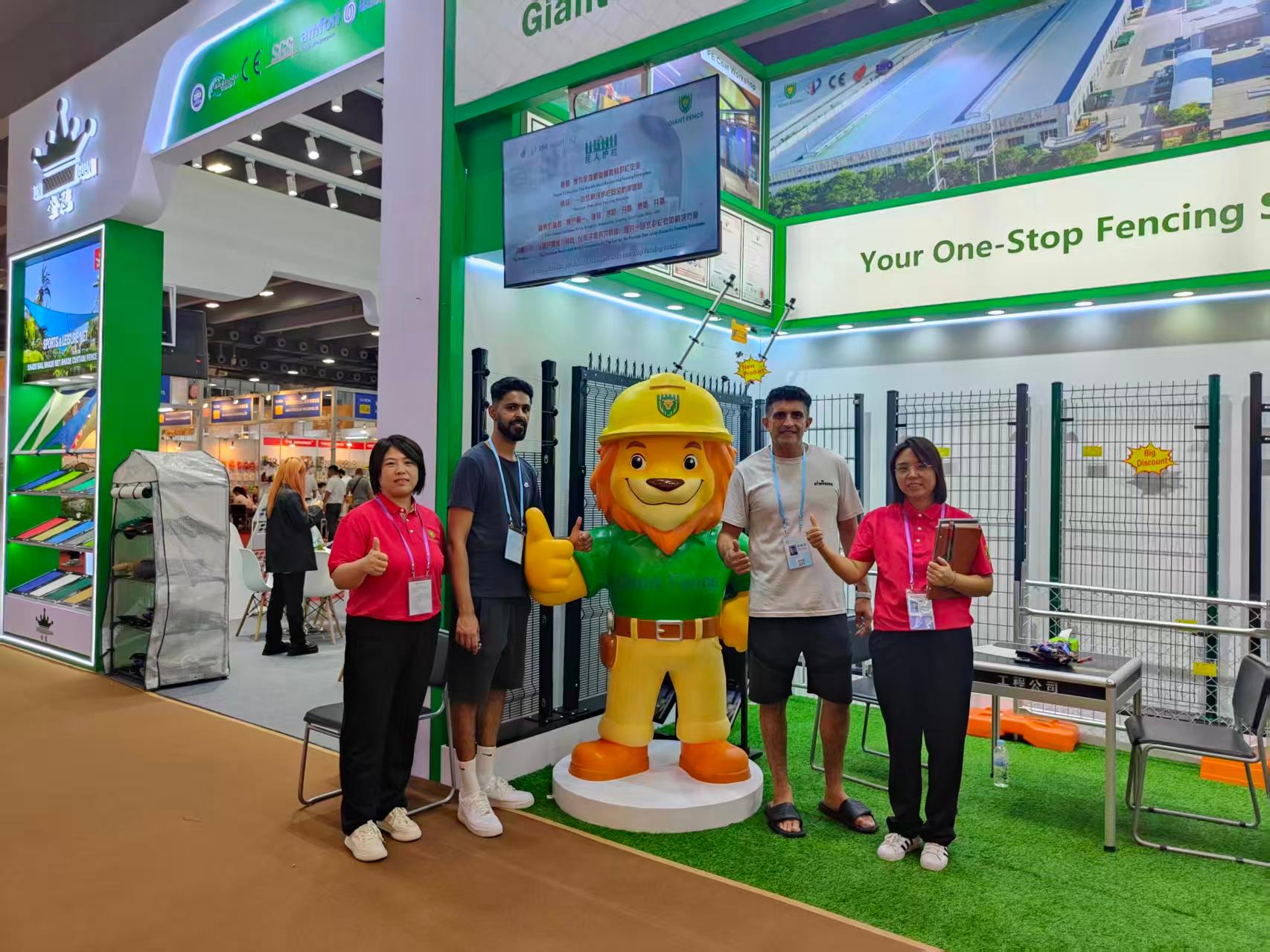 Person standing in a factory with machinery in the background