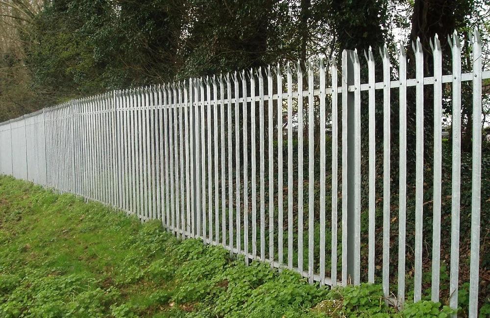 Person standing in a factory with machinery in the background